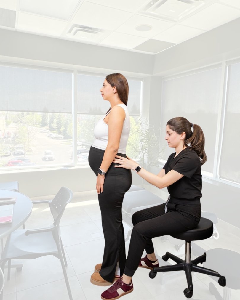 Relief for Pregnancy Sciatica: How a Prenatal Chiropractor in York Region Can Help Dr. Pegah performing a standing prenatal posture assessment at Vieno Wellness